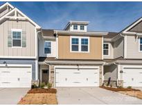 Attractive two-story townhome with a two-car garage at 140 Halite Ln, Waxhaw, NC 28173