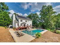 Home with solar panels, deck, and inground pool at 164 Quiet Cove Rd, Mooresville, NC 28117