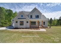 Stunning farmhouse exterior with charming curb appeal at 145 Harbor Ridge Dr # 120, Statesville, NC 28677