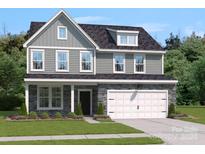 Two-story house with gray siding and stone accents at 315 Coronado Ave # 63, Matthews, NC 28104
