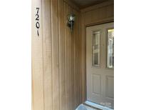 Front door entrance with stained-glass accents and light fixture at 7201 Winery Ln, Charlotte, NC 28227