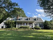 Ranch home with covered porch and mature landscaping at 331 Polk Ford Rd, Stanfield, NC 28163