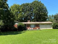 Brick ranch house with attached garage and large front yard at 4549 Nc Highway 109 N Hwy, Troy, NC 27371