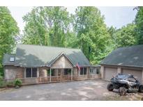 House exterior with attached garage and driveway at 506 Island Ford Rd, Statesville, NC 28625