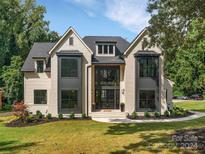 Stunning two-story home with a modern farmhouse design, featuring a neutral color palette and black accents at 3500 Barclay Downs Dr, Charlotte, NC 28209