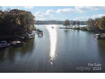 Aerial view of calm lake with houses and docks at 151 River Ridge Ln, Statesville, NC 28677