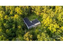 Aerial view of single Gathering home in wooded area at 9224 Maggie Robinson Rd, Waxhaw, NC 28173