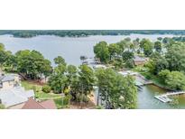 Aerial view of lakefront property with houses and lush greenery at 2580 Penngate Dr, Sherrills Ford, NC 28673