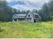 Under construction home with large windows and a covered porch at 700 Bellegray Rd # 4, Clover, SC 29710