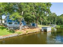 Lovely waterfront home with private dock and boathouse at 50444 Haven Bend Rd, Albemarle, NC 28001