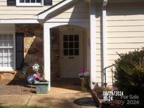 House entrance with stone accents and landscaping at 7118 Quail Meadow Ln, Charlotte, NC 28210