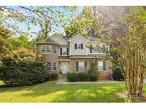 Two story house with brick and siding exterior, and a landscaped lawn at 1229 Brecken Ct, Kannapolis, NC 28081
