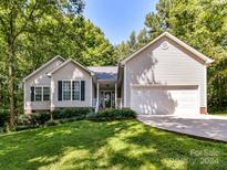 House exterior features a two-car garage and well-manicured lawn at 700 Cove Rd, Gastonia, NC 28052