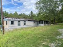 Mobile home with a screened porch and yard at 6134 Shirley Rd, Fort Lawn, SC 29714