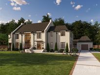 Two-story home with a grand entrance and attached garage at 427 Jefferson Dr, Charlotte, NC 28270