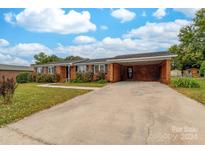 Brick ranch house with attached carport at 814 Rhodann Dr, Shelby, NC 28152