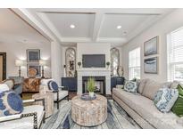 Modern living room with fireplace, built-ins, and stylish furnishings at 3020 Endhaven Terraces Ln # 10, Charlotte, NC 28277