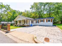 Newly renovated house with a spacious front yard and large driveway at 607 Ligon St, Shelby, NC 28150