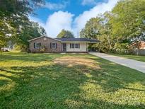 Ranch style brick house with a carport and yard at 1525 Vanderlip Dr, Gastonia, NC 28052