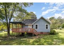 Charming gray house with a deck and gazebo, situated on a grassy lot at 4236 Cureton Ferry Rd, Catawba, SC 29704