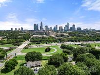 Aerial view showing home and city skyline in the distance at 225 Flint St, Charlotte, NC 28216