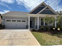 Stunning two-story home with a welcoming front porch and gray exterior at 1049 Bull Dog Ln, Wingate, NC 28174