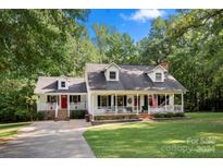 Ranch house exterior with a front porch and well-manicured lawn at 1447 London Dr, Rock Hill, SC 29732