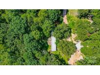 Aerial view of a mobile home nestled in a lush, wooded area at 1022 Jw Wilson Rd, Fort Mill, SC 29715