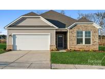 Brick and shingle front exterior of charming ranch-style home with two-car garage at 2243 Carpenter Farms Dr, Lincolnton, NC 28092