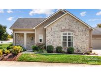 Charming ranch home with stone accents and landscaped yard at 4759 Polo Gate Blvd, Charlotte, NC 28216