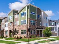 Modern townhome with brick and siding exterior at 2318 Medley Dr, Charlotte, NC 28262