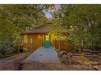 Round house exterior with a charming green door and walkway at 241 Spring Shore Rd, Statesville, NC 28677