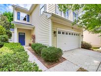 Inviting two-story home with a blue door and attached garage at 1001 Serel Dr, Matthews, NC 28104