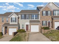 Brick front end unit townhome with 2-car garage at 7215 Gallery Pointe Ln, Charlotte, NC 28269