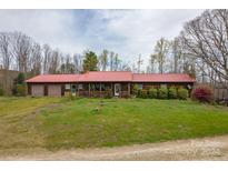 Ranch home with attached garage and red roof at 225 Frye Hts, Taylorsville, NC 28681