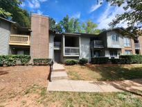 Condo building exterior with steps leading to entrance at 5012 Sardis Rd # D, Charlotte, NC 28270