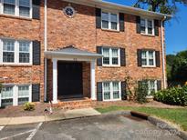 Brick building exterior with a central entrance at 910 Mcalway Rd # A, Charlotte, NC 28211
