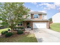 Two-story house with stone and wood siding, a covered porch, and a two-car garage at 4493 Haddington Dr # 154, Fort Mill, SC 29707