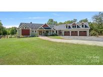 Spacious home with attached three-car garage and landscaped yard at 5510 Hoodtown Rd, Sharon, SC 29742