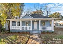 Charming craftsman home with a newly renovated exterior and a welcoming front porch at 4319 Hovis Rd, Charlotte, NC 28208