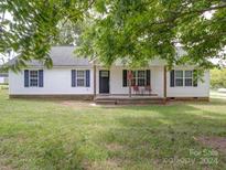 White home with covered porch, and landscaping at 4616 Canal Rd, Marshville, NC 28103