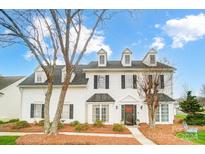 Two-story white house with black shutters, landscaping, and a walkway at 5811 Creft Cir, Indian Trail, NC 28079