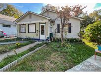 Charming bungalow with a well maintained front yard at 412 E 18Th St, Charlotte, NC 28206
