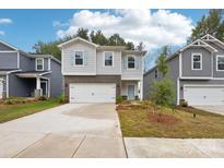 Two-story brick and siding house with attached garage at 3041 Summit Oaks Rd, Charlotte, NC 28269