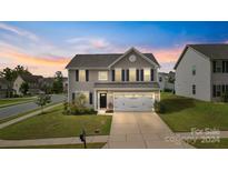 Two-story house with a two-car garage and landscaping at 1814 Mill Creek Ln, Concord, NC 28025