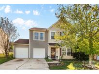 Two-story house with gray siding and two-car garage at 5051 Meanna Dr, Clover, SC 29710