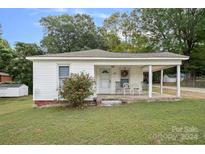 Charming one-story home with covered porch and well-maintained lawn at 900 Alma Ave, Kannapolis, NC 28081