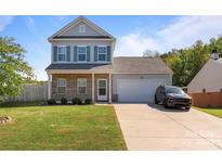 Two-story house with gray siding, brick accents, and a two-car garage at 214 Austen Lakes Dr # 96, York, SC 29745