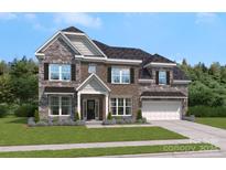 Two story home with stone and brick accents at 312 Balboa St # 17, Matthews, NC 28104