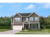 Two-story house with gray siding and a two car garage at 311 Coronado Ave # 62, Matthews, NC 28104